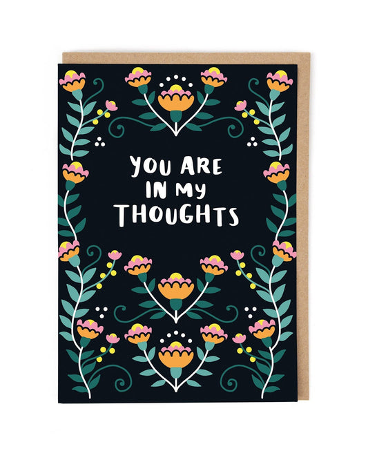 Greeting card with floral design and text 'You are in my thoughts' on a black background