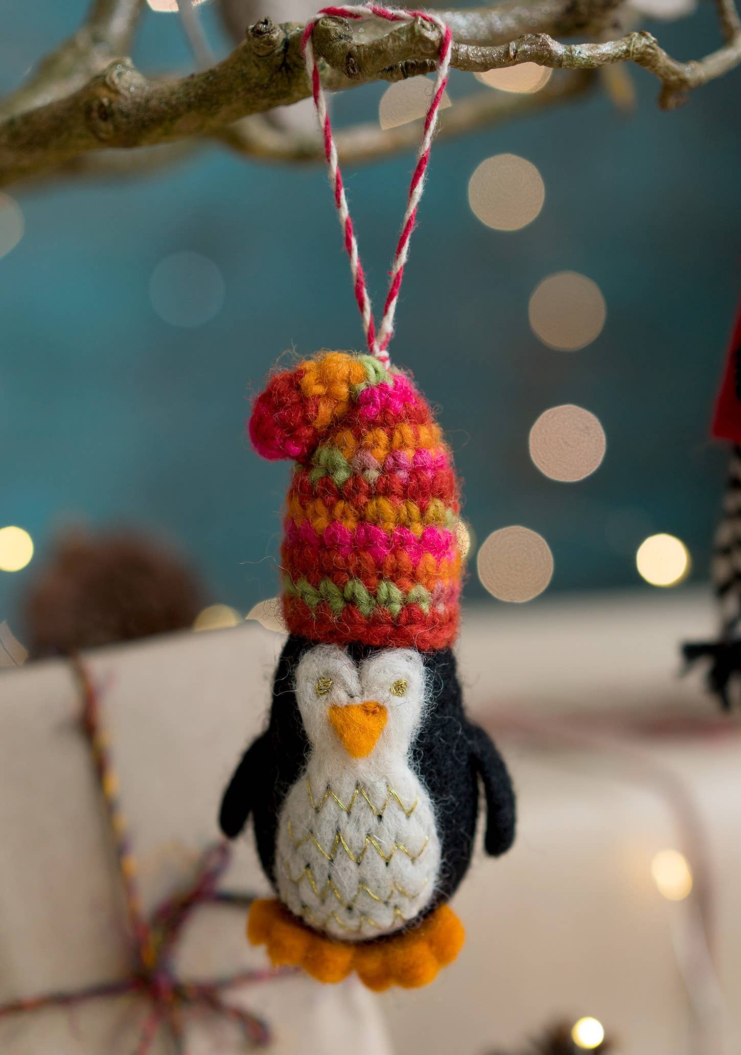 Felted penguin in wooly hat