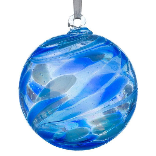 A round glass Christmas ornament with a swirled blue and light blue pattern, featuring a silver hanging loop at the top, shown against a plain white background.