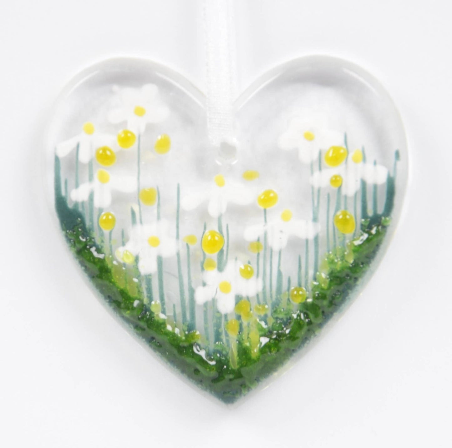 Heart-shaped object with a floral design on a white background