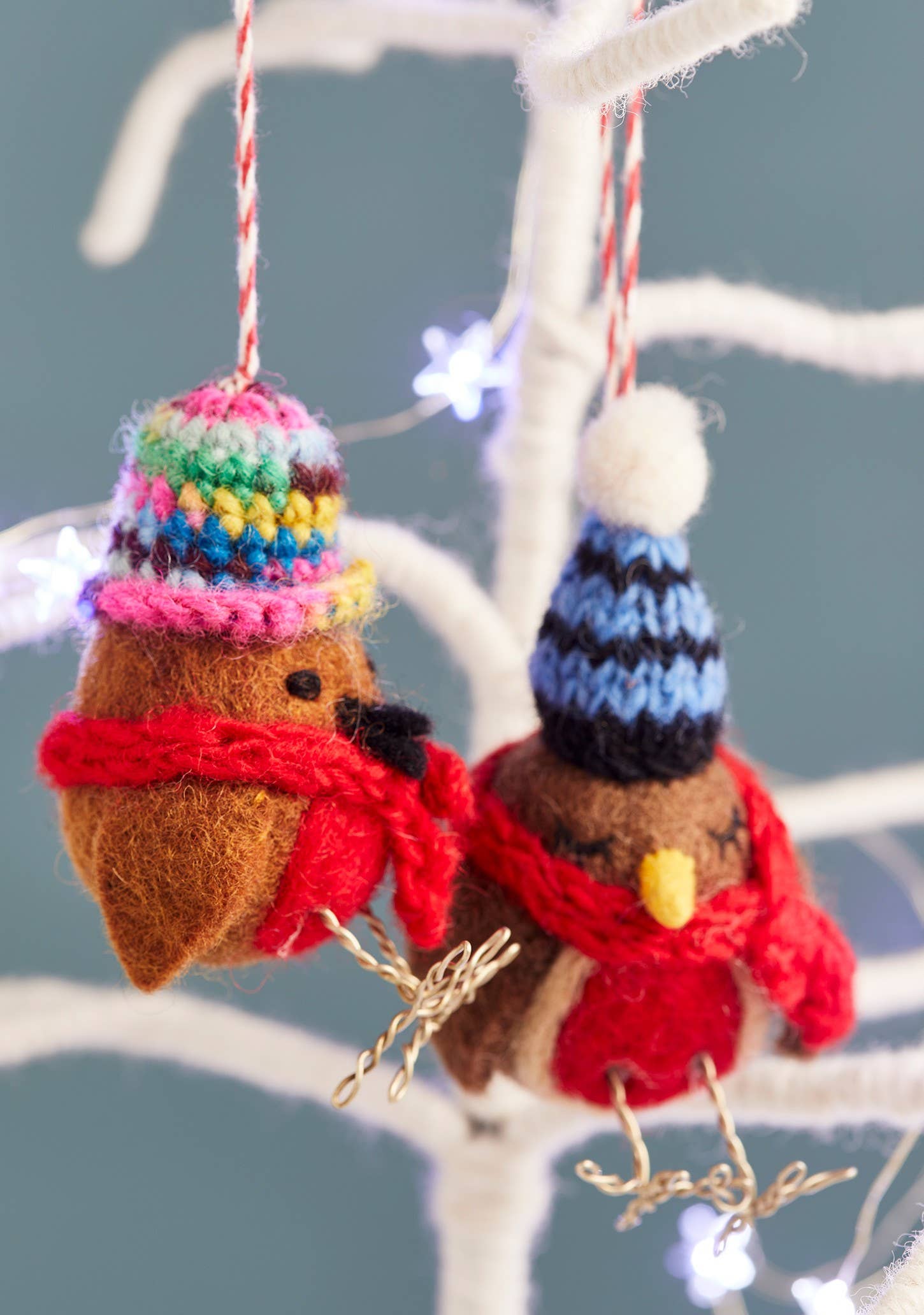 Felted robin with woolly hat and scarf.