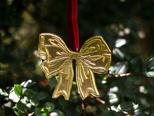 Christmas decoration enamel detail and ribbon.