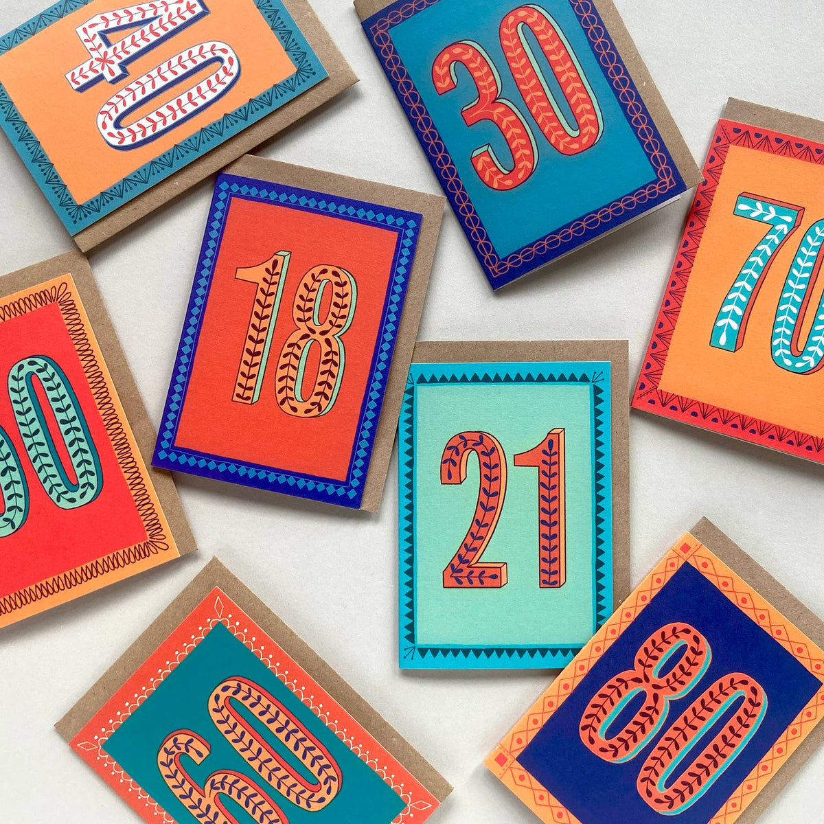 Colorful number cards with decorative borders on a white background