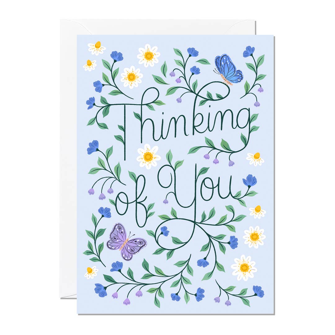 Greeting card with floral design and butterflies on a light blue background