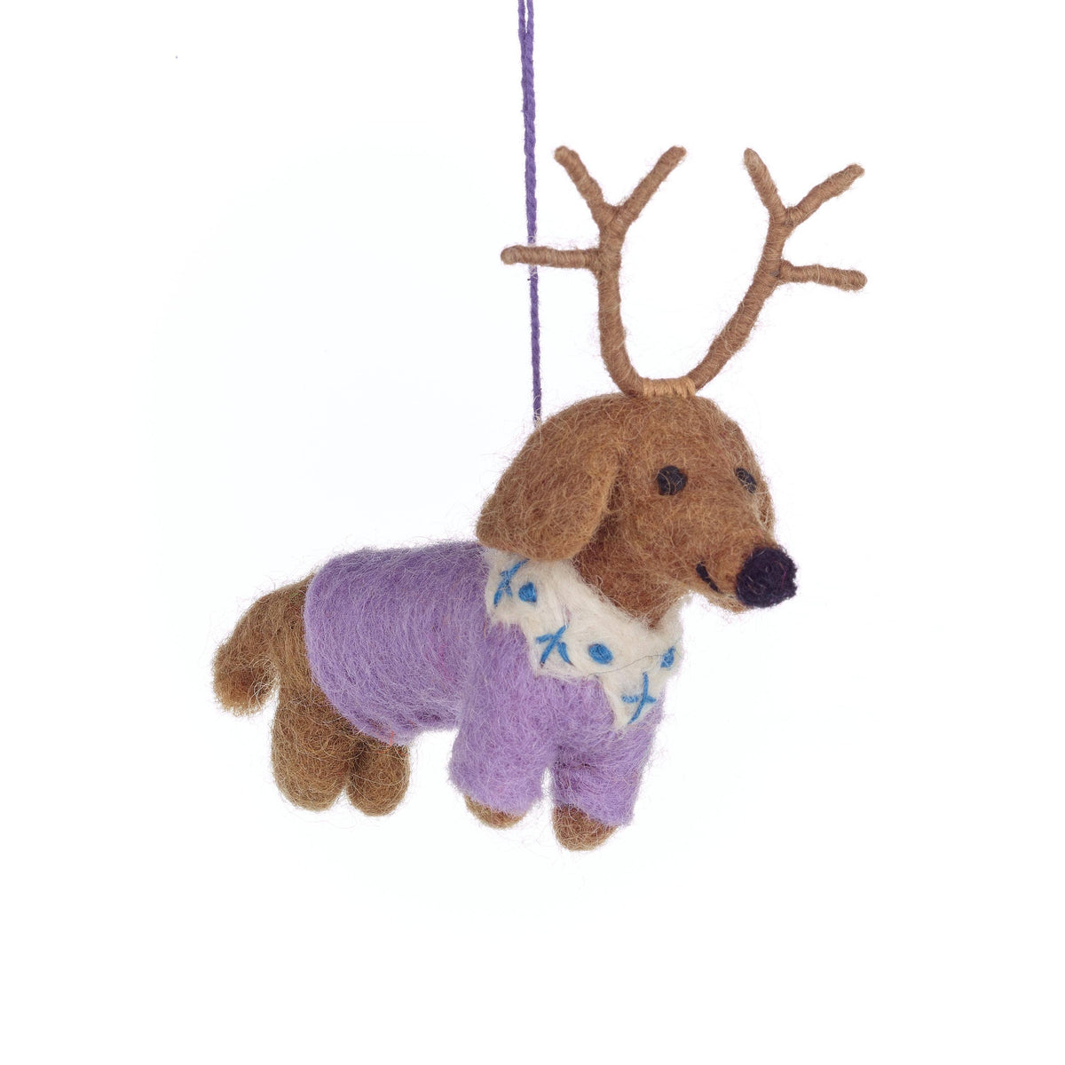 Decorative ornament of a dog with antlers wearing a sweater on a white background