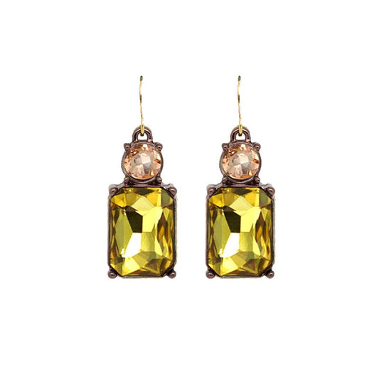 Pair of earrings with yellow gemstones on a white background