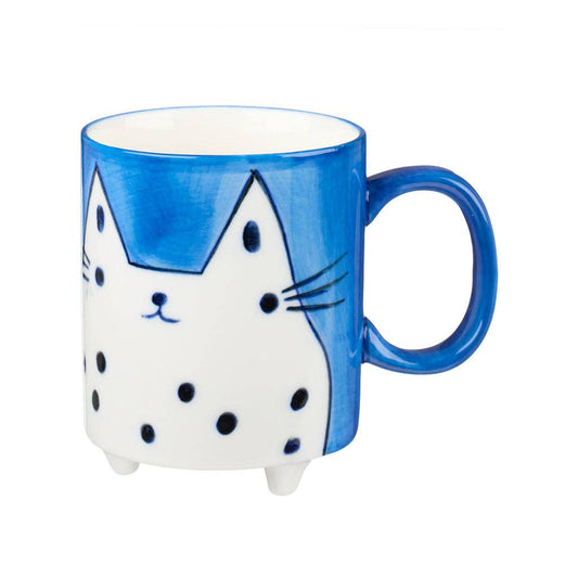 Cat-shaped mug with blue and white design on a white background
