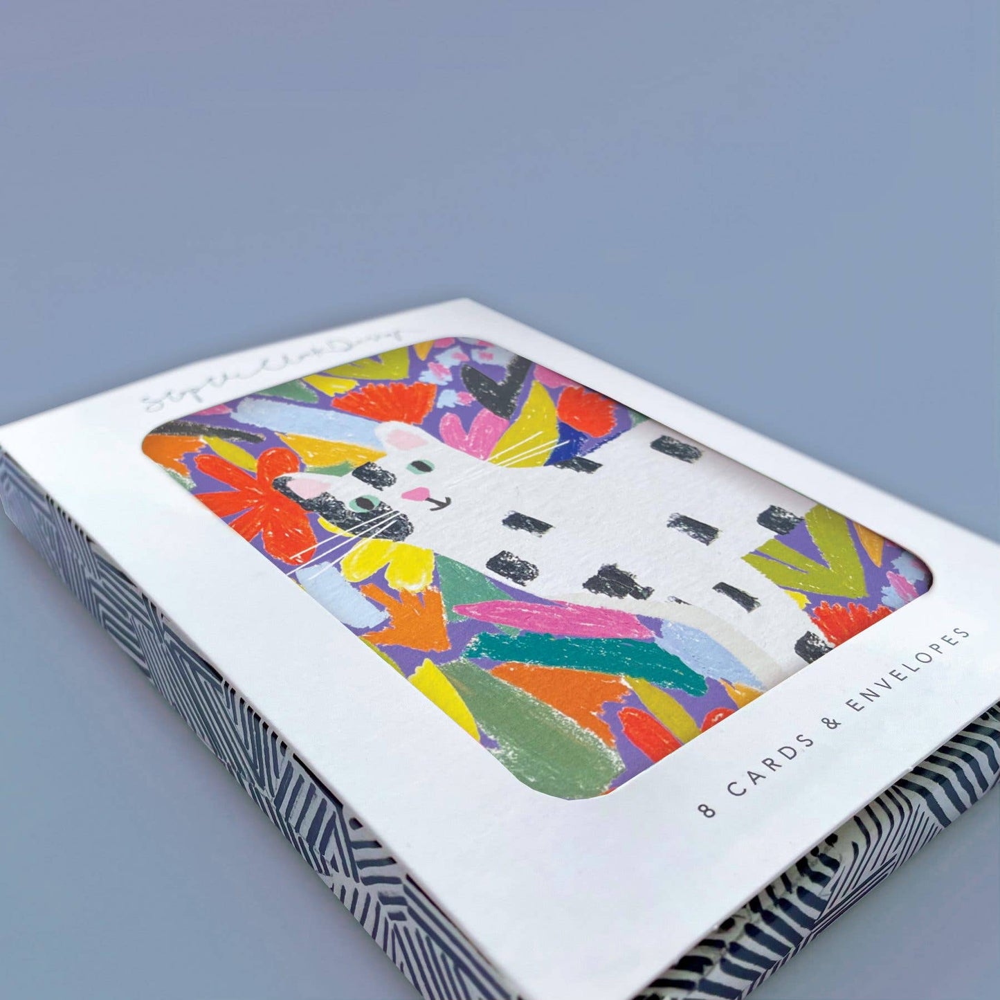 Pack of greeting cards with colorful abstract design on a gray background
