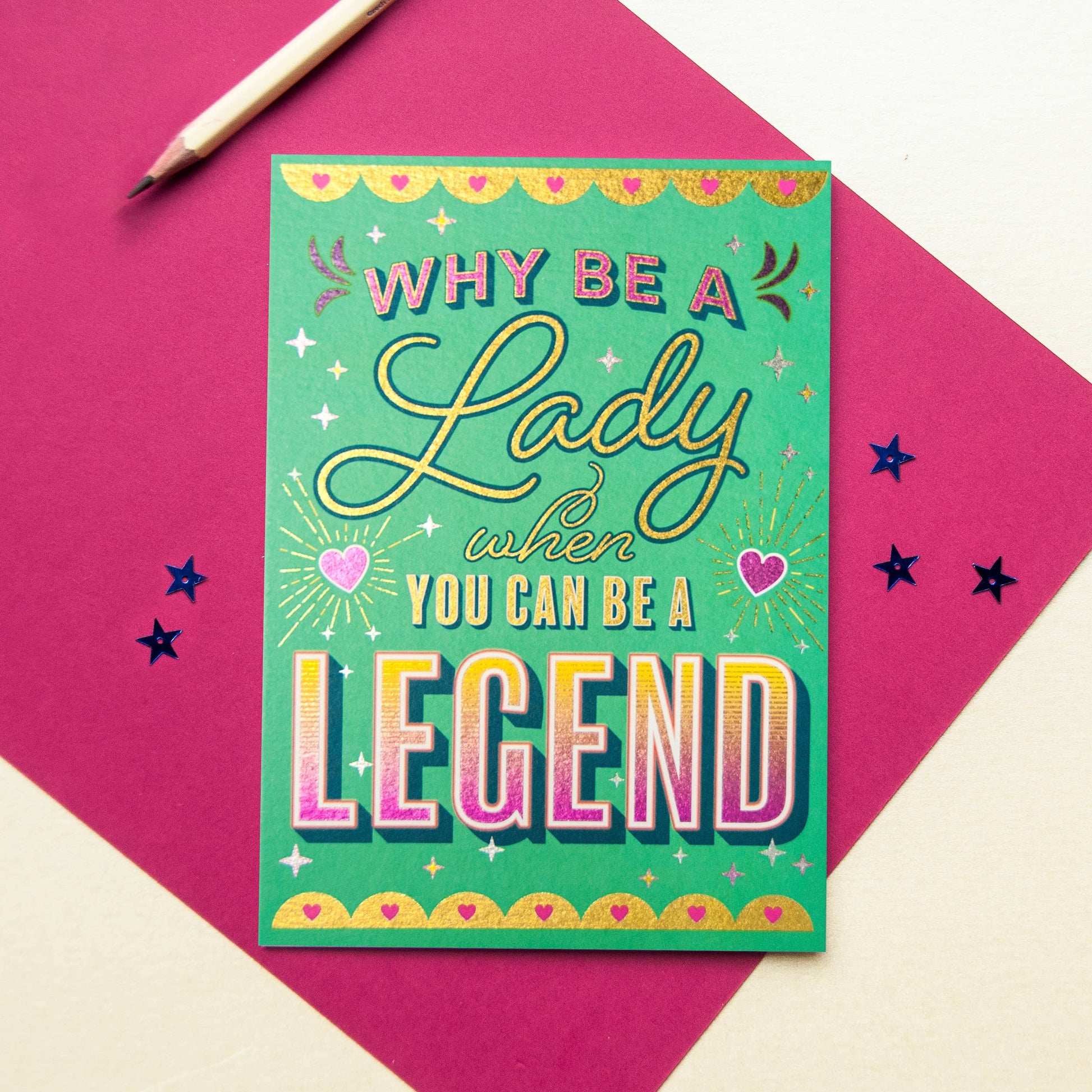 A green card with the text "Why be a lady when you can be a legend".