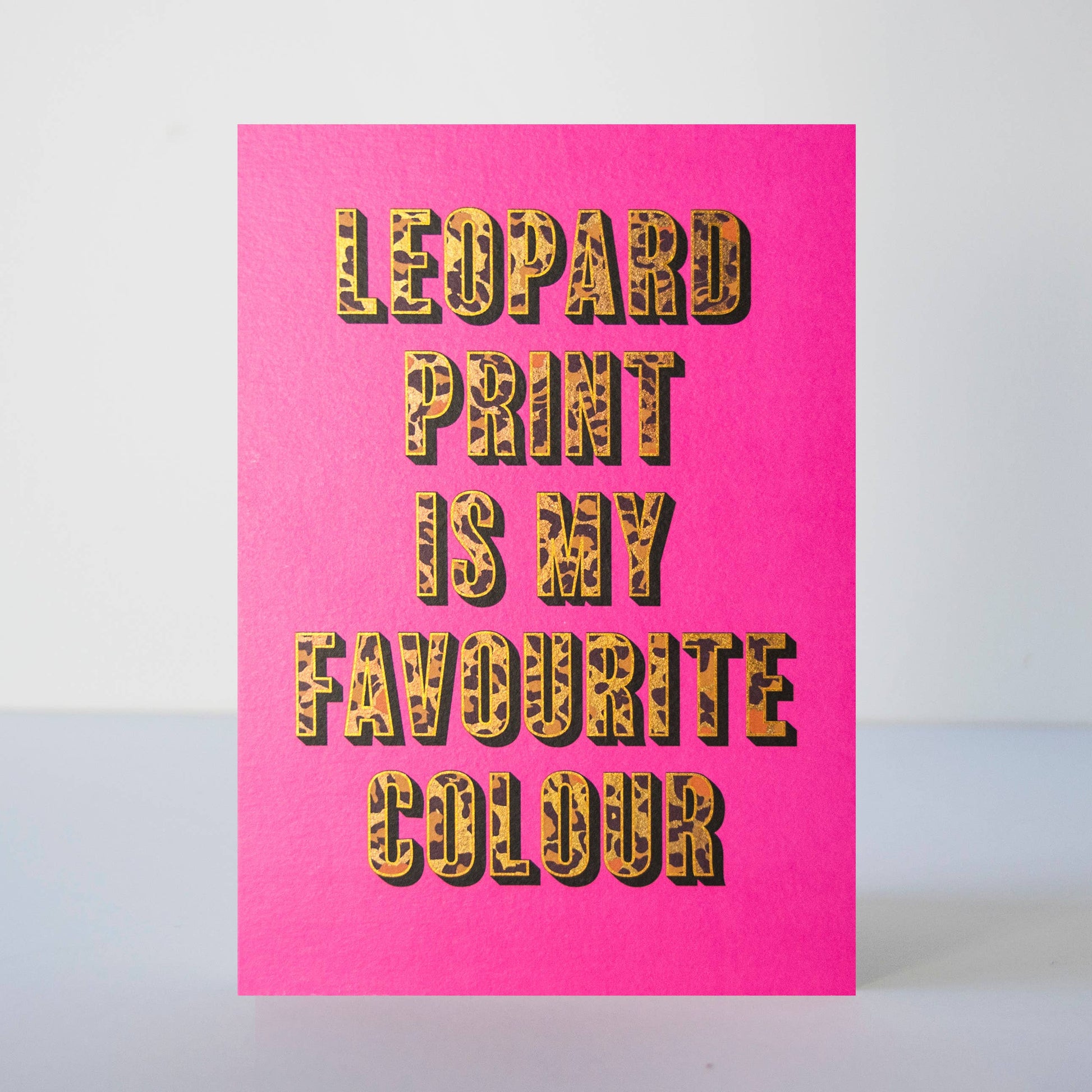 A hot pink card with the phrase "leopard print is my favourite colour" in leopard print block capitals.
