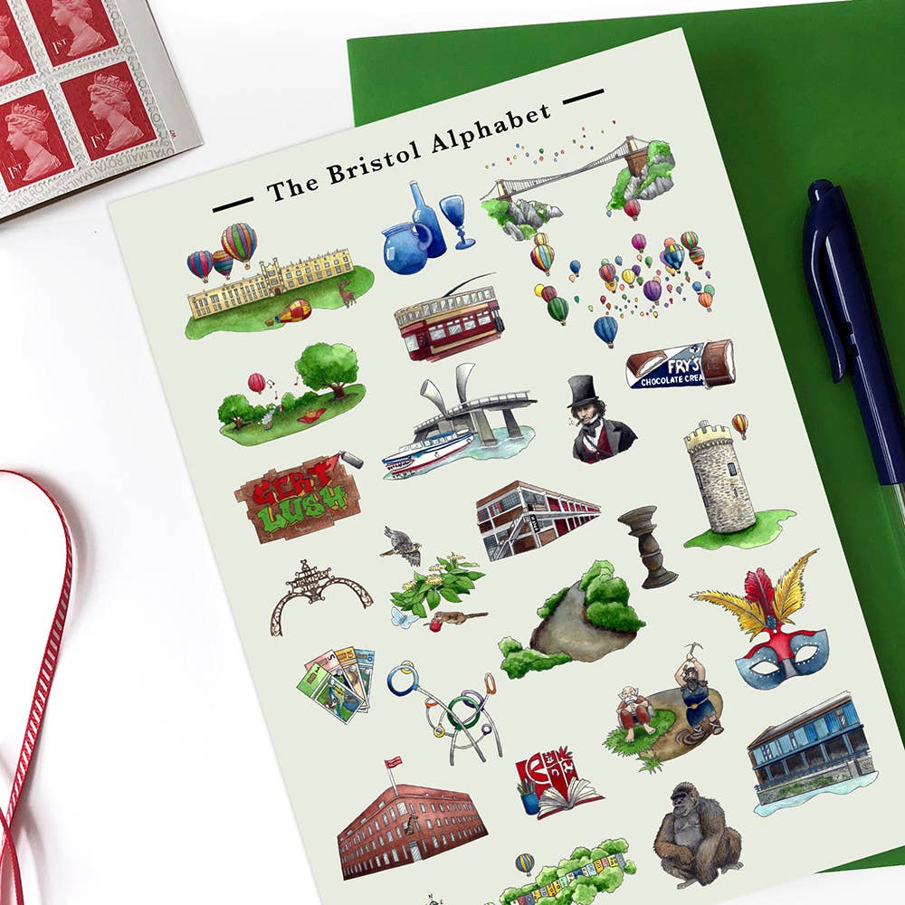 Sheet of 'The Bristol Alphabet' stickers with illustrations on a green surface.