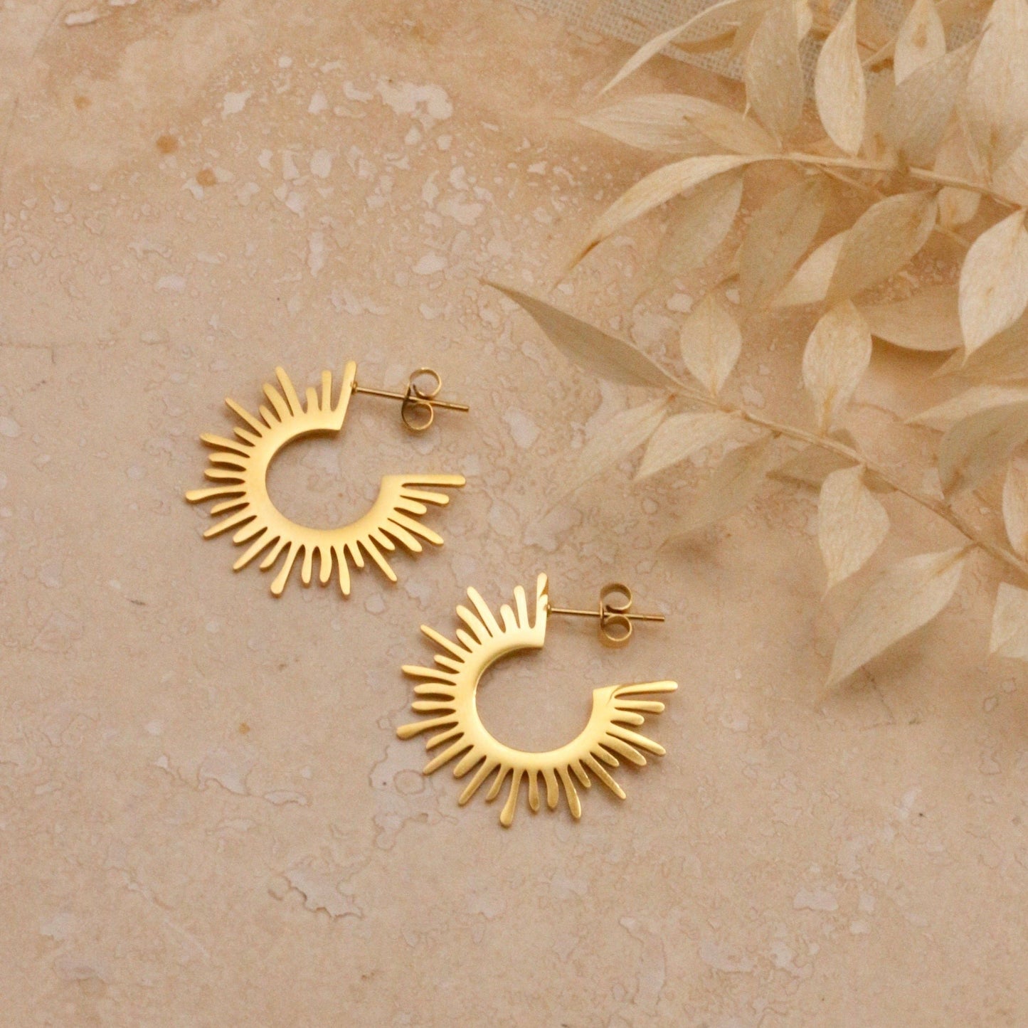 18 carat gold plated studs shaped to represent the suns rays.