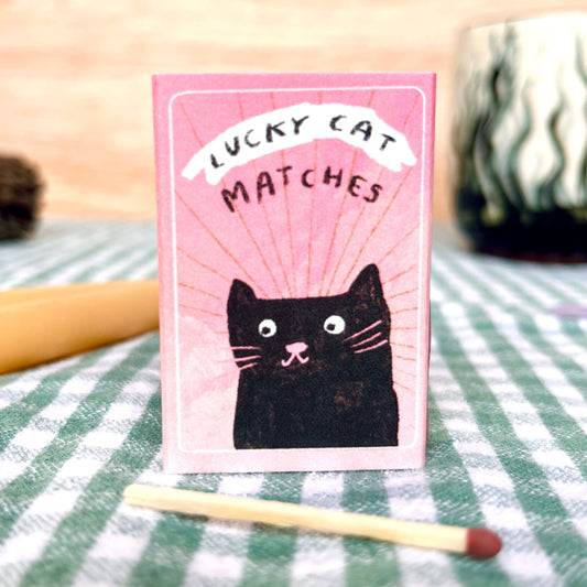 Box of matches, with cat on front and text reading Lucky Cat Matches
