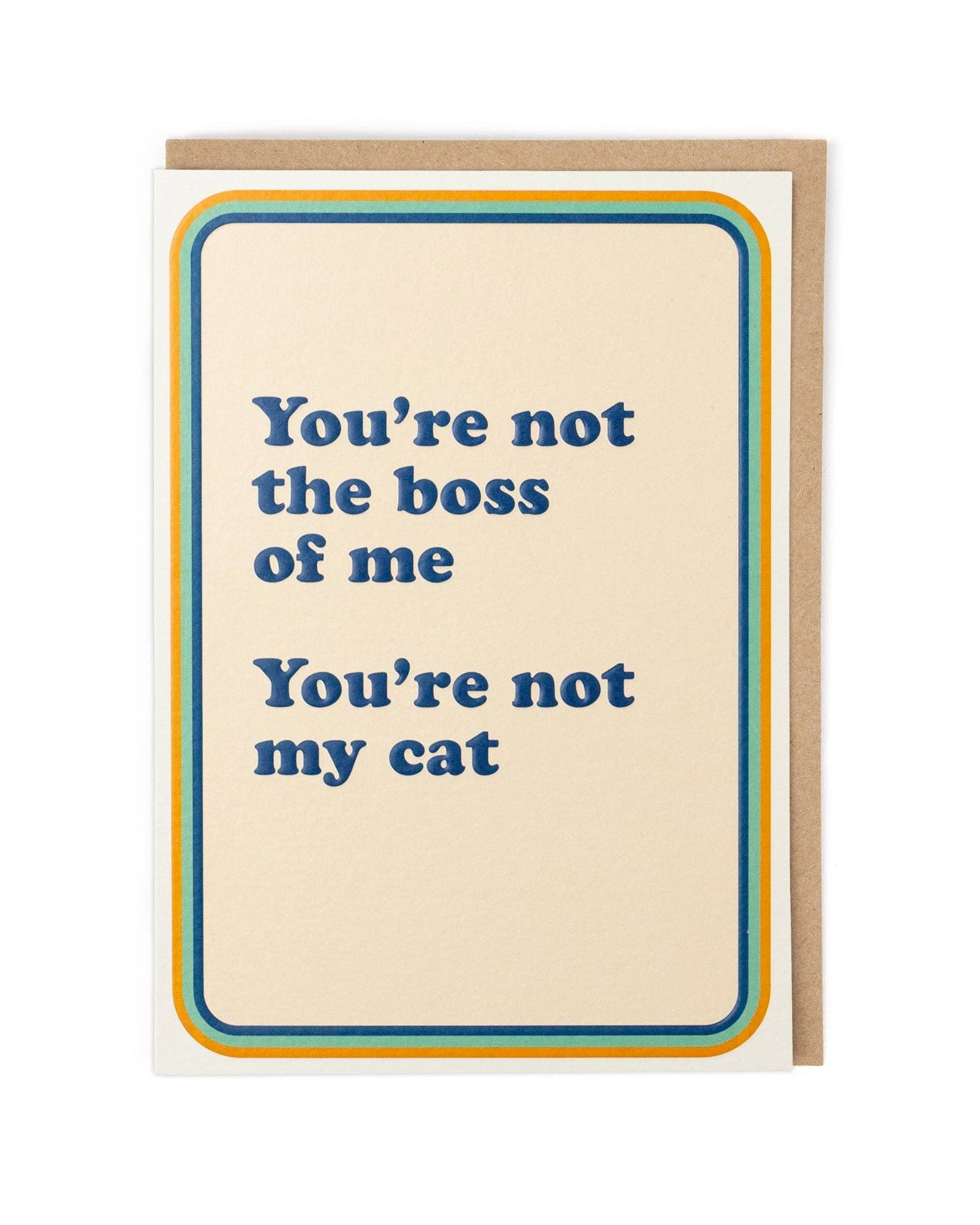 Card with humorous text 'You're not the boss of me, You're not my cat' on a beige background.