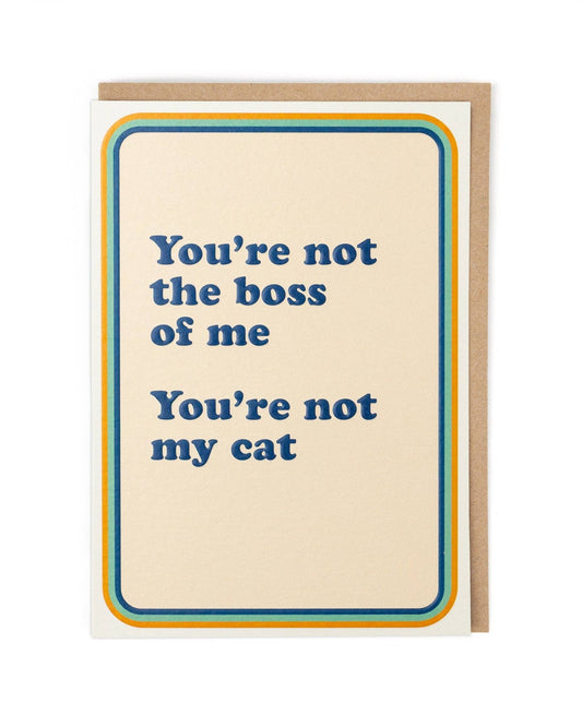 Card with humorous text 'You're not the boss of me, You're not my cat' on a beige background.