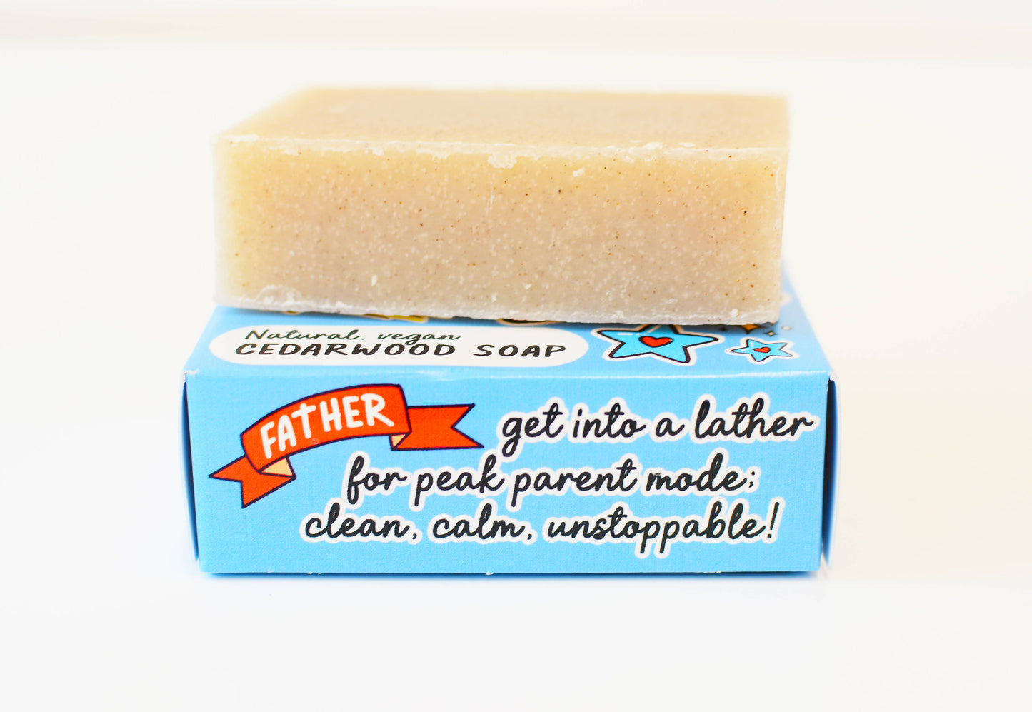 Bar of soap on a blue box with text, against a white background