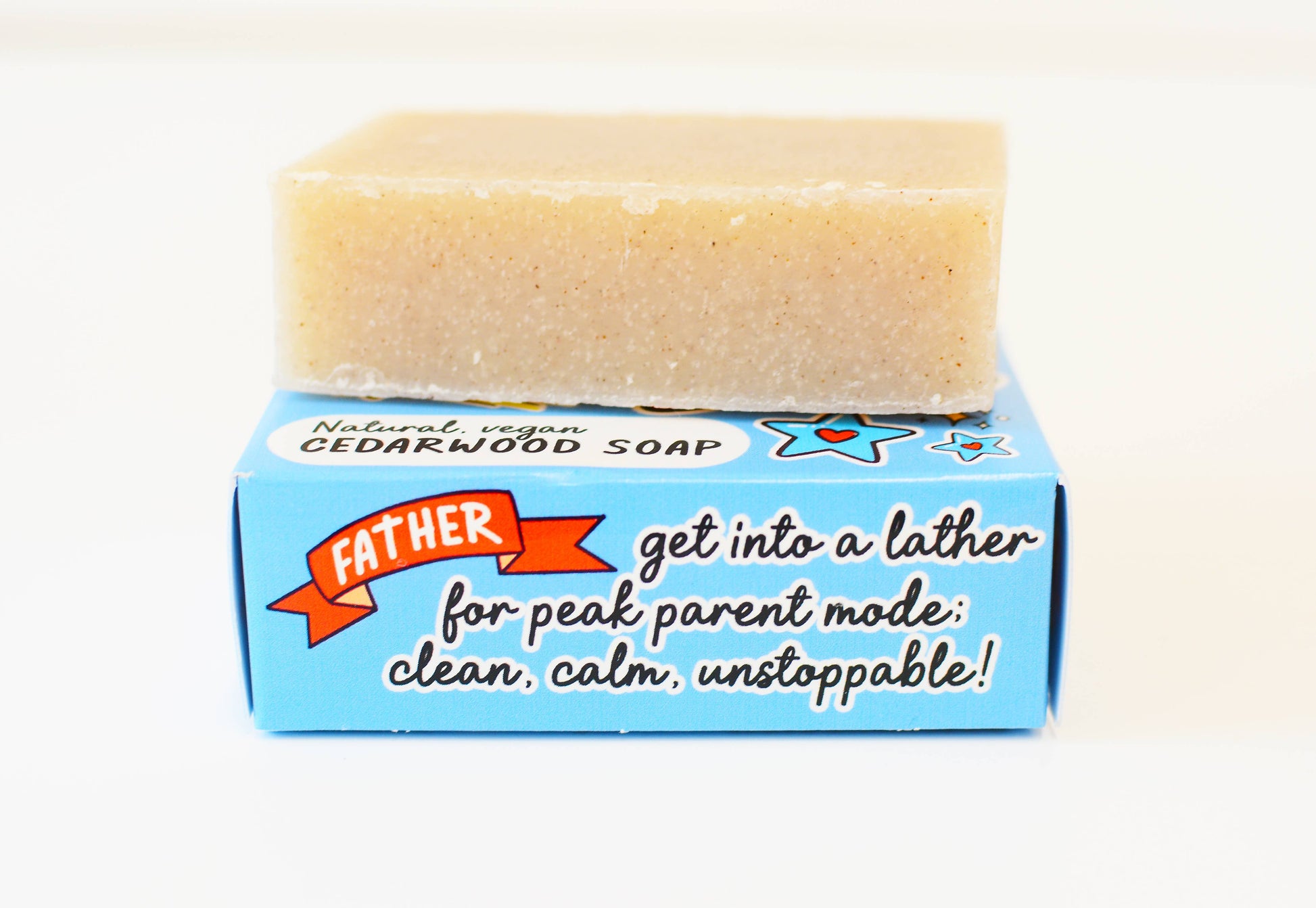 Bar of soap on a blue box with text, against a white background