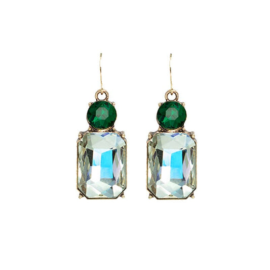 Pair of earrings with green gemstones and clear rectangular stones on a white background