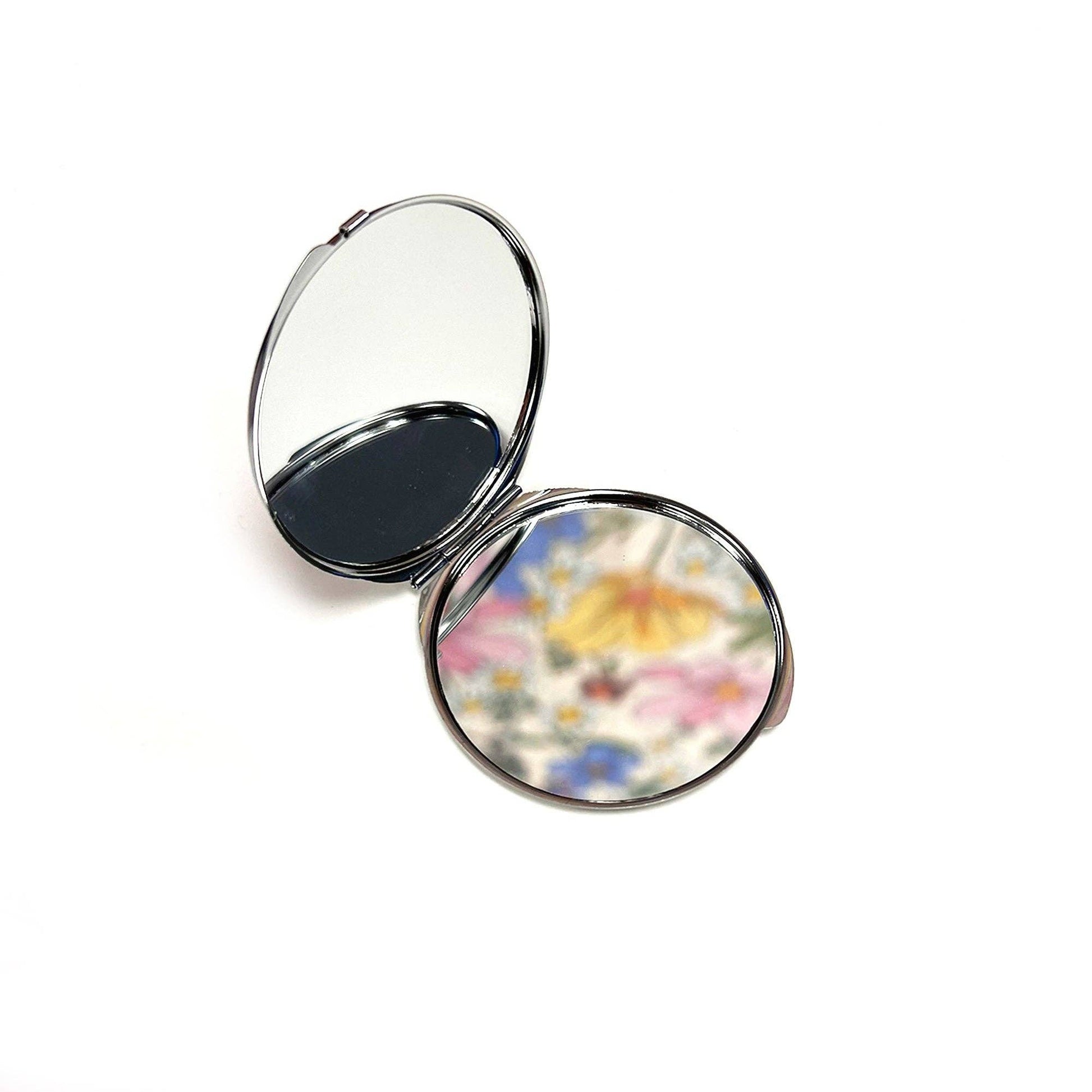 Small mirror compact with the words Fresh out of Fucks.