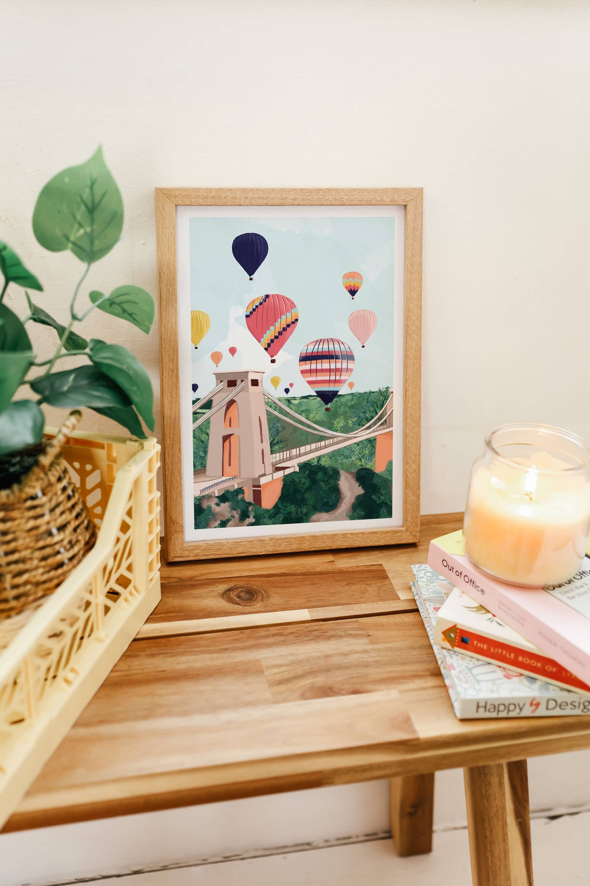 Colourful illustration of Clifton Suspension Bridge in Bristol with hot air balloons