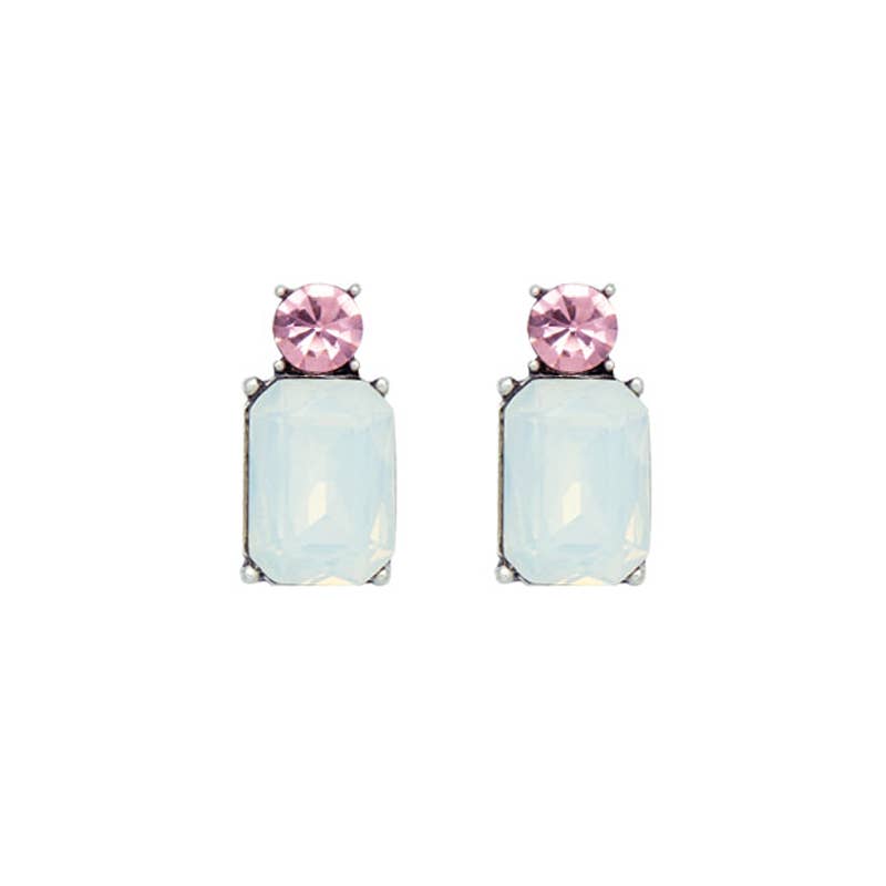 Pair of earrings with pink and opal gemstones on a white background
