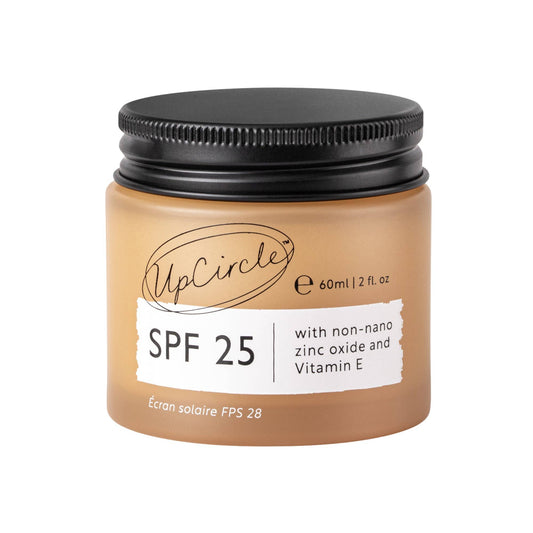 Jar of sunscreen cream with SPF 25 on a white background