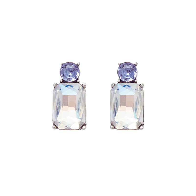 Pair of earrings with clear and purple gemstones on a white background