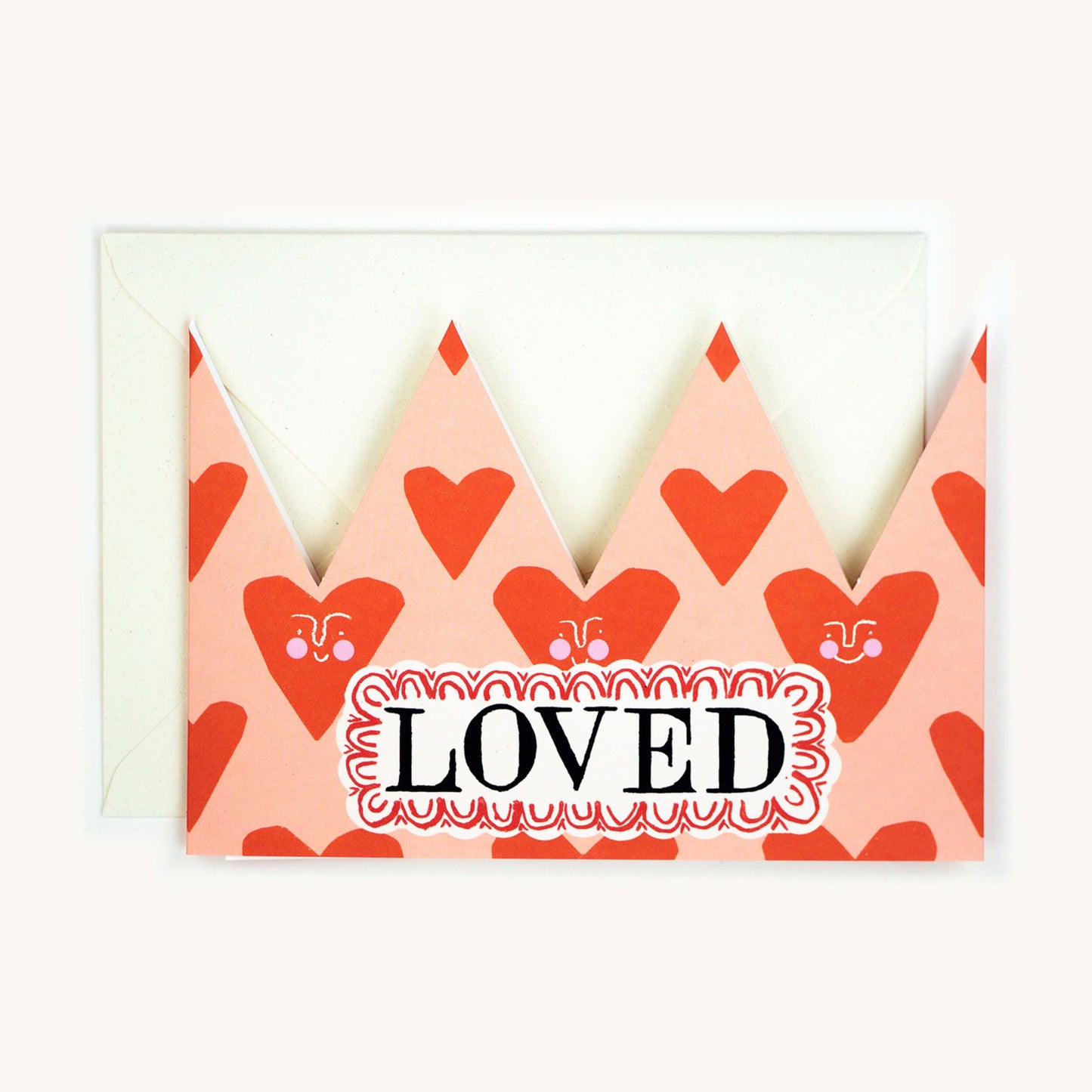 Party hat card with hearts and text reading loved.