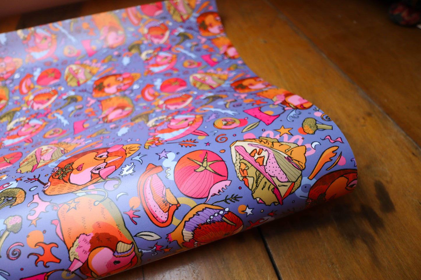 Colourful wrapping paper with guinea pigs wearing crowns.