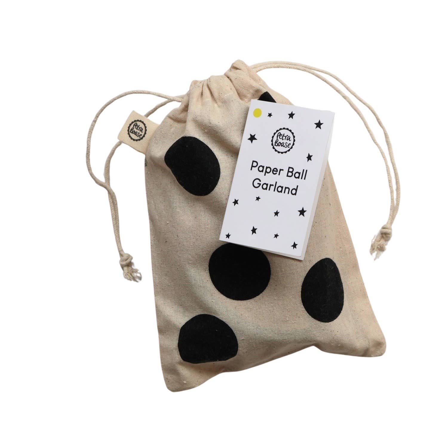 Beige drawstring bag with black polka dots and a white tag on a white background