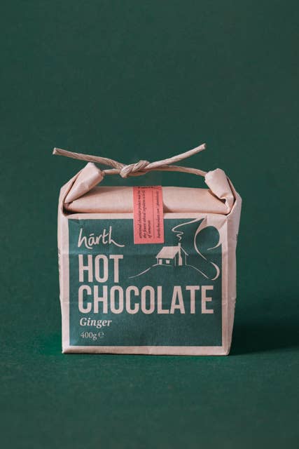 Box of hārth hot chocolate ginger on a green background