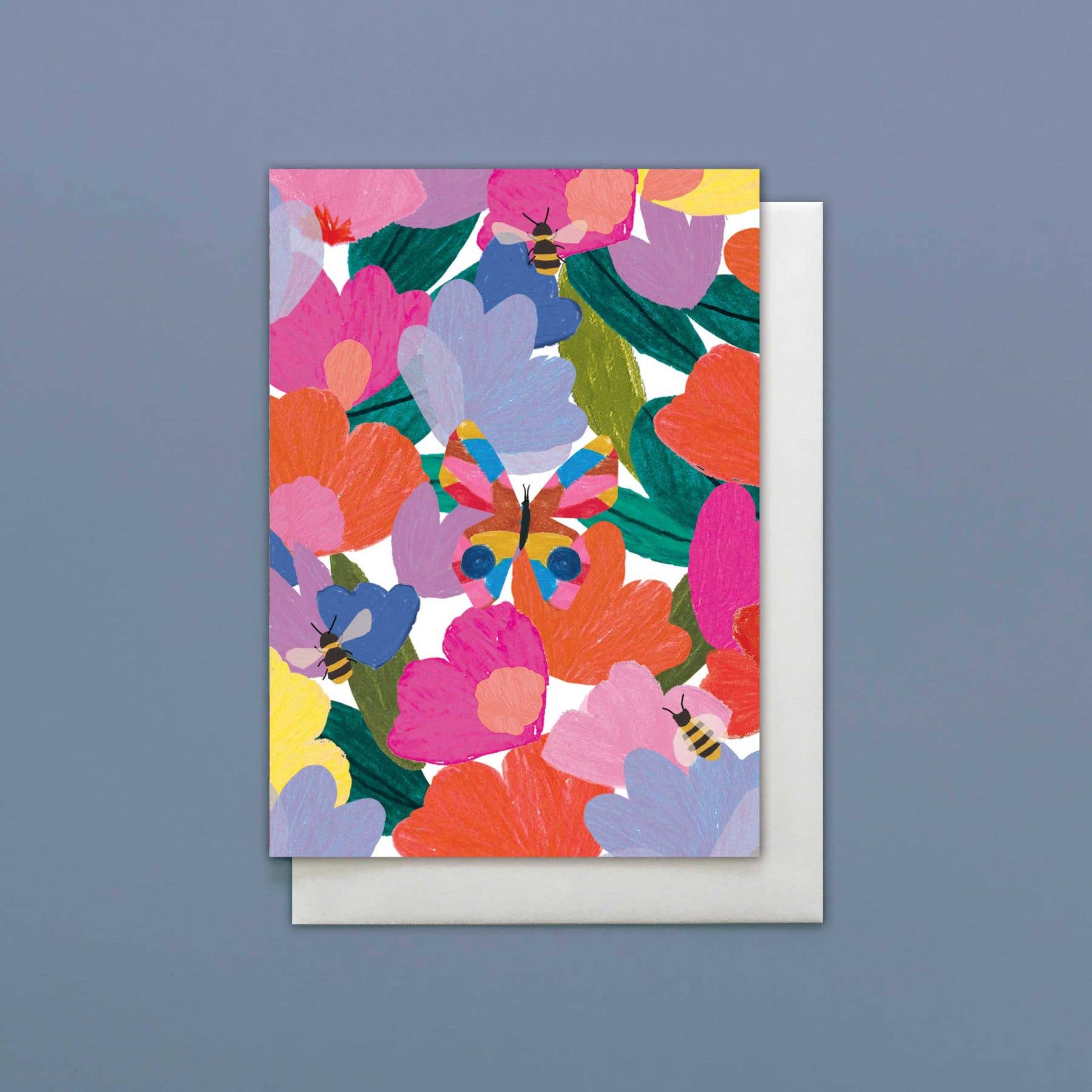 Colorful floral card with a white envelope on a gray background