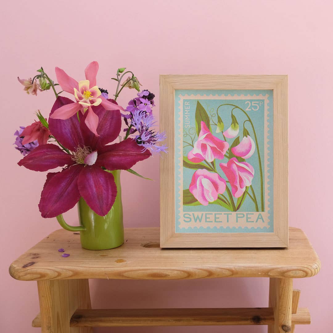 Risograph print of a sweet pea on a stamp