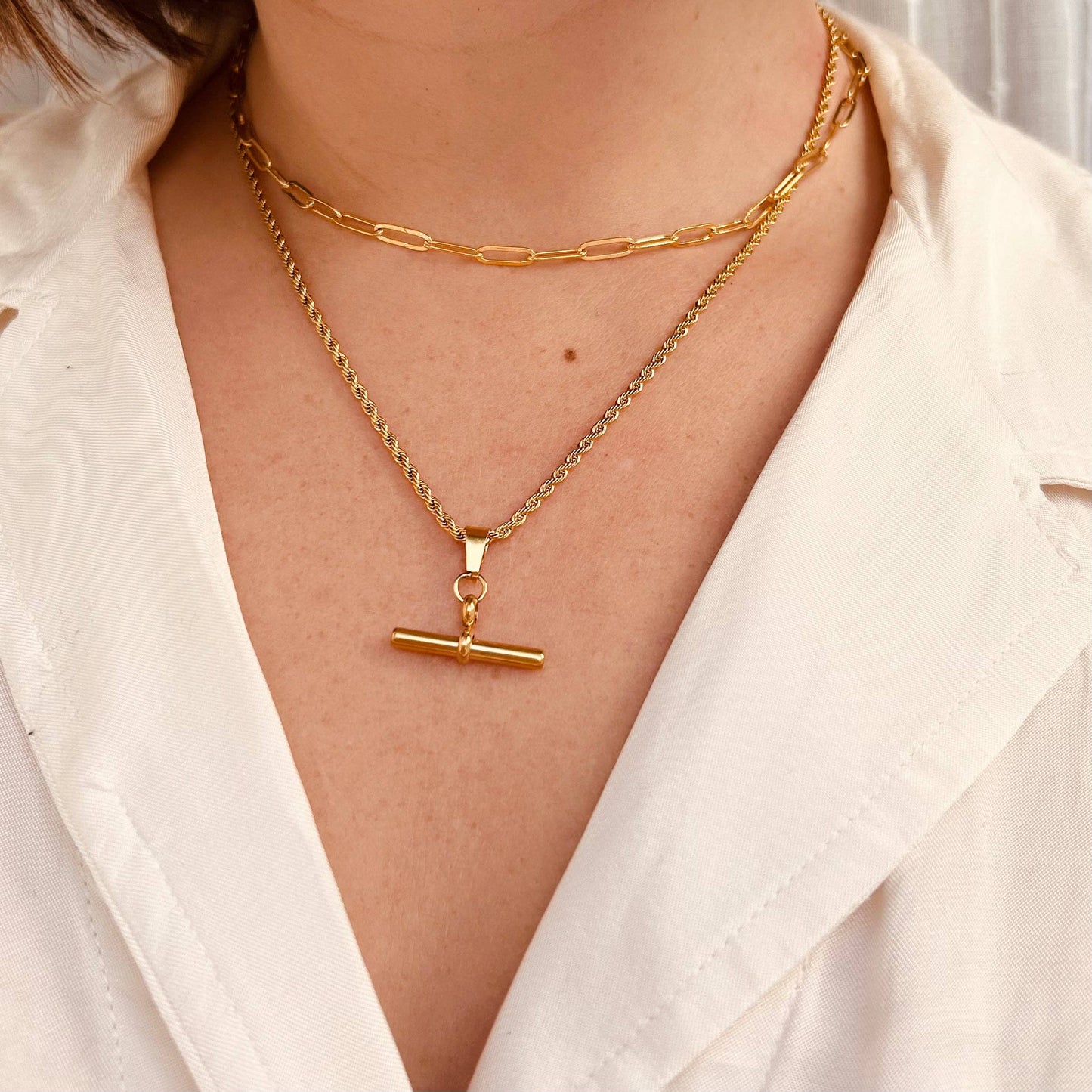 Gold plated bar pendant on a twisted chain.