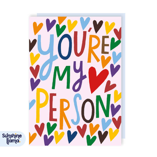 Colorful card with 'You're my person' text and heart shapes on a white background