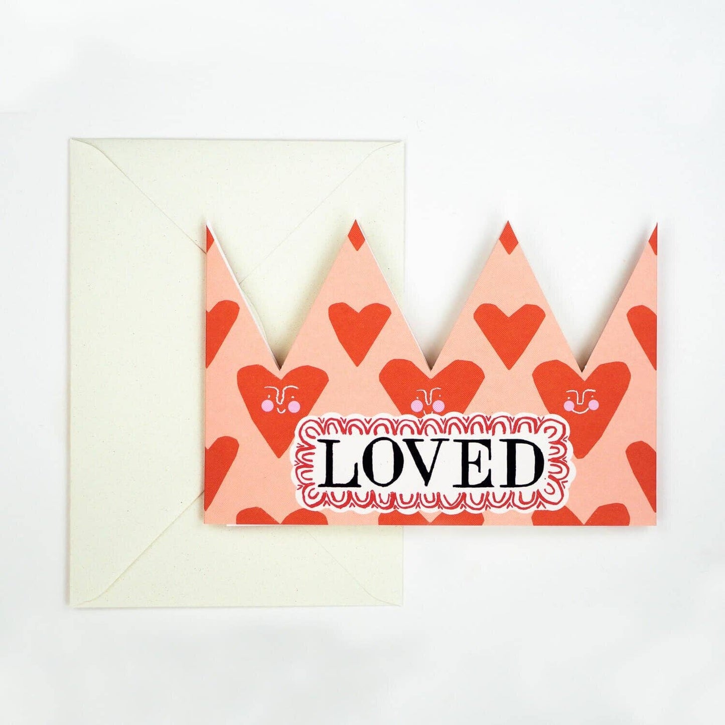 Card with heart pattern and 'LOVED' text on a white background