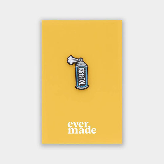 Spray can pin on a yellow card with 'ever made' branding