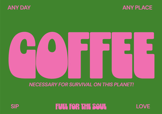 Framed poster with pink 'COFFEE' text on a green background, placed on a light surface with plants around