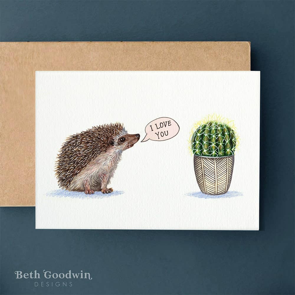 Greeting card with a hedgehog and cactus saying 'I love you' on a blue background