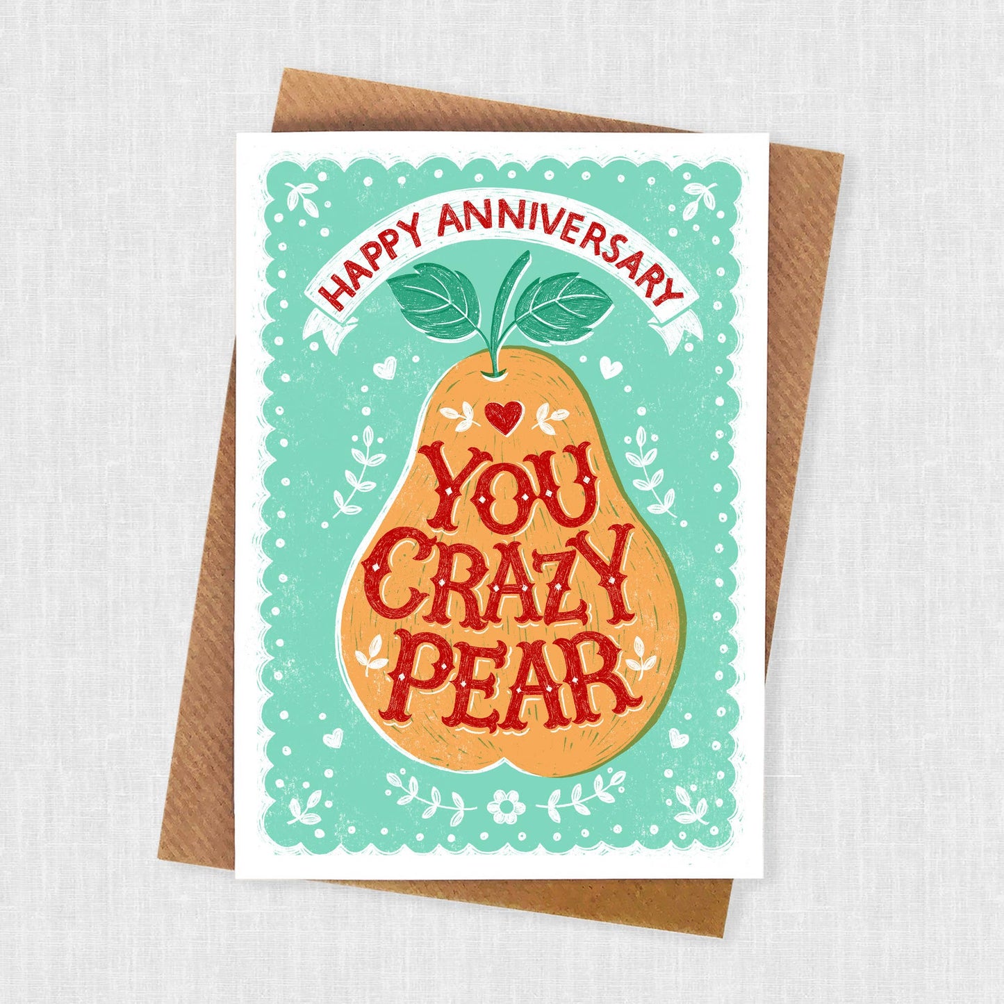 Anniversary Card.  An orange pear with teal patterned background.  Text reads Happy Anniversary.  Text in pear reads You Crazy Pear.