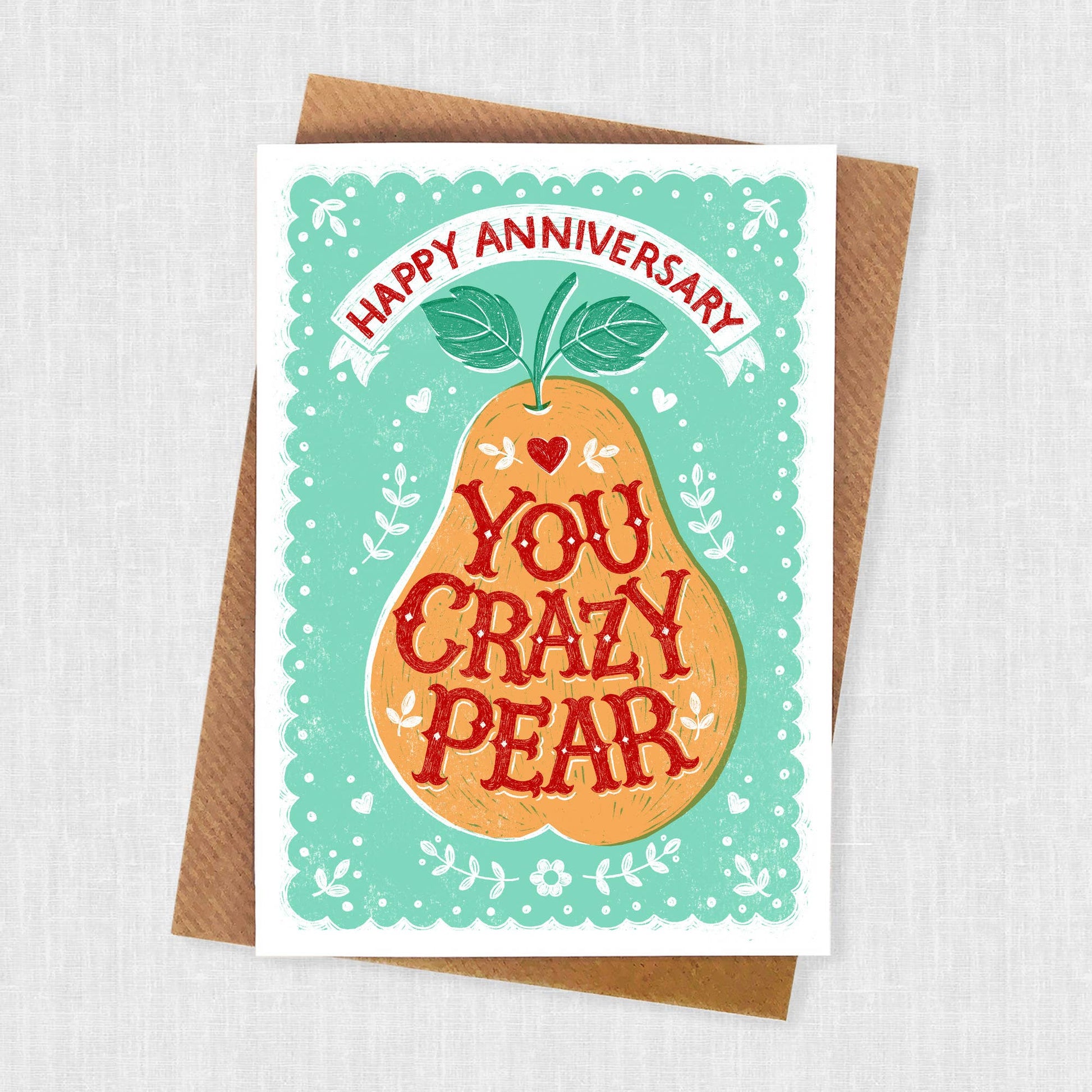 Anniversary Card.  An orange pear with teal patterned background.  Text reads Happy Anniversary.  Text in pear reads You Crazy Pear.