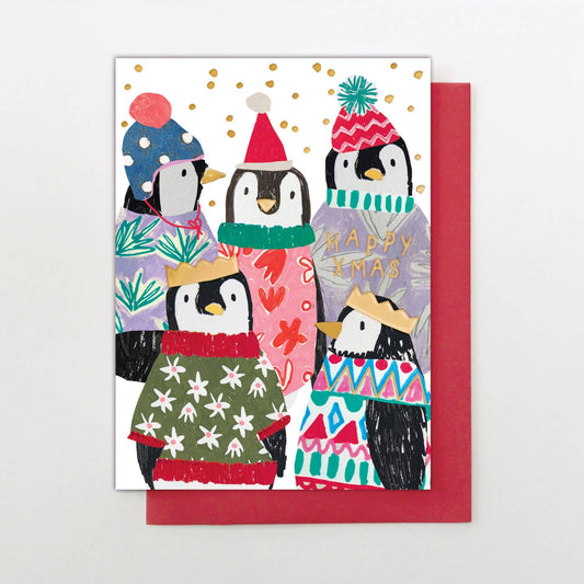 Christmas card with penguins wearing colorful hats and scarves on a white background