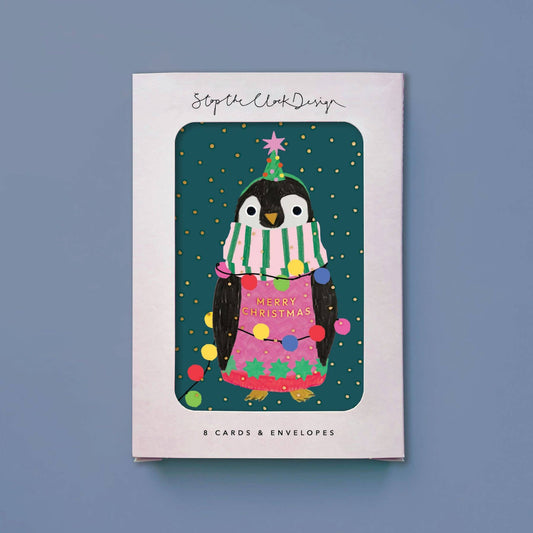 Pack of Christmas cards with a penguin design on a blue background