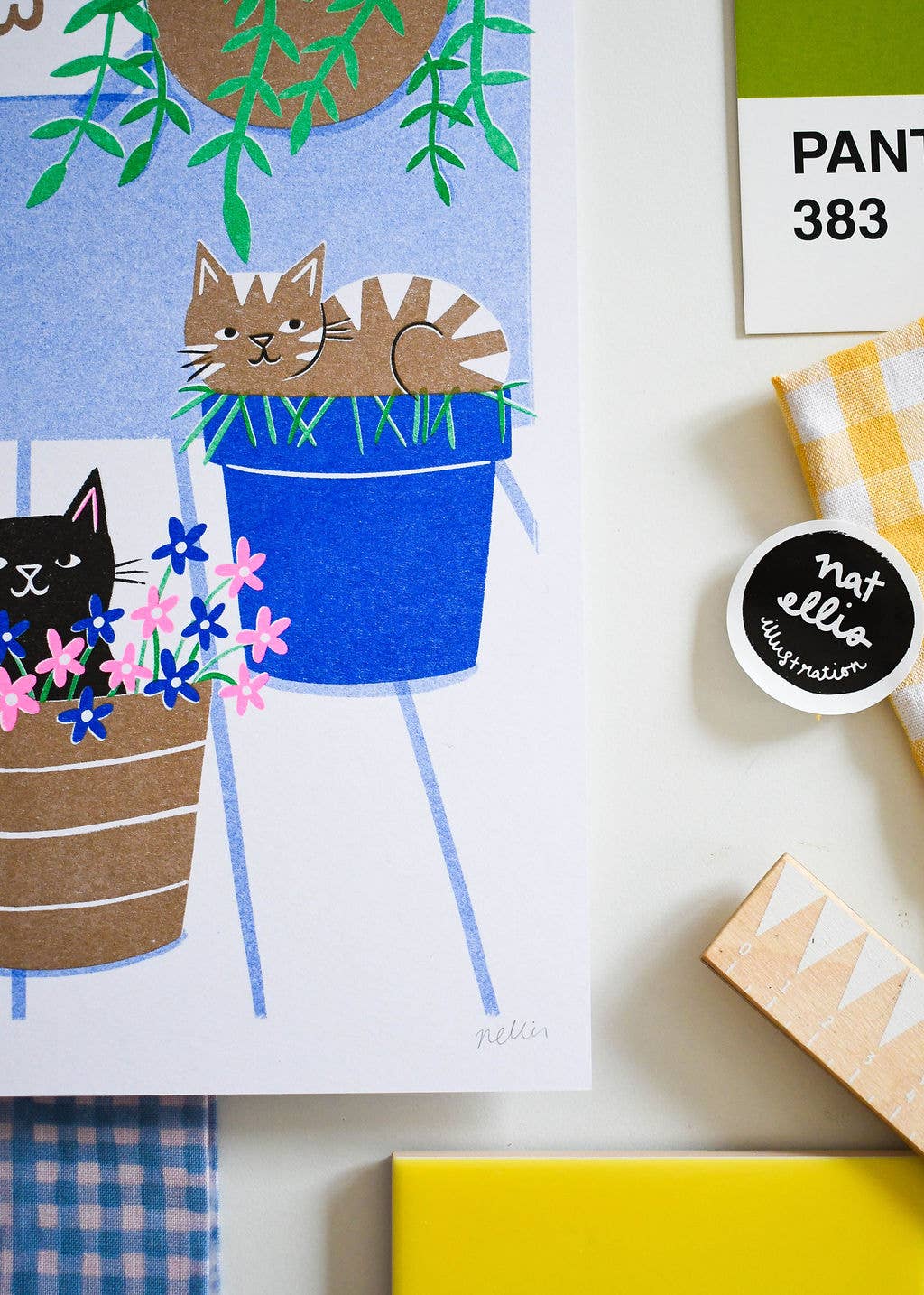 Illustration of cats in plant pots with a 'Natalie Ellis Illustrations' stamp.