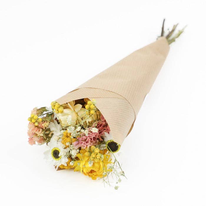 Bouquet of flowers wrapped in brown paper on a white background