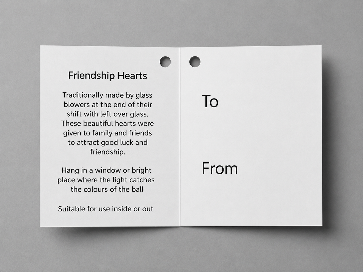 Open card with text about friendship hearts on a gray background