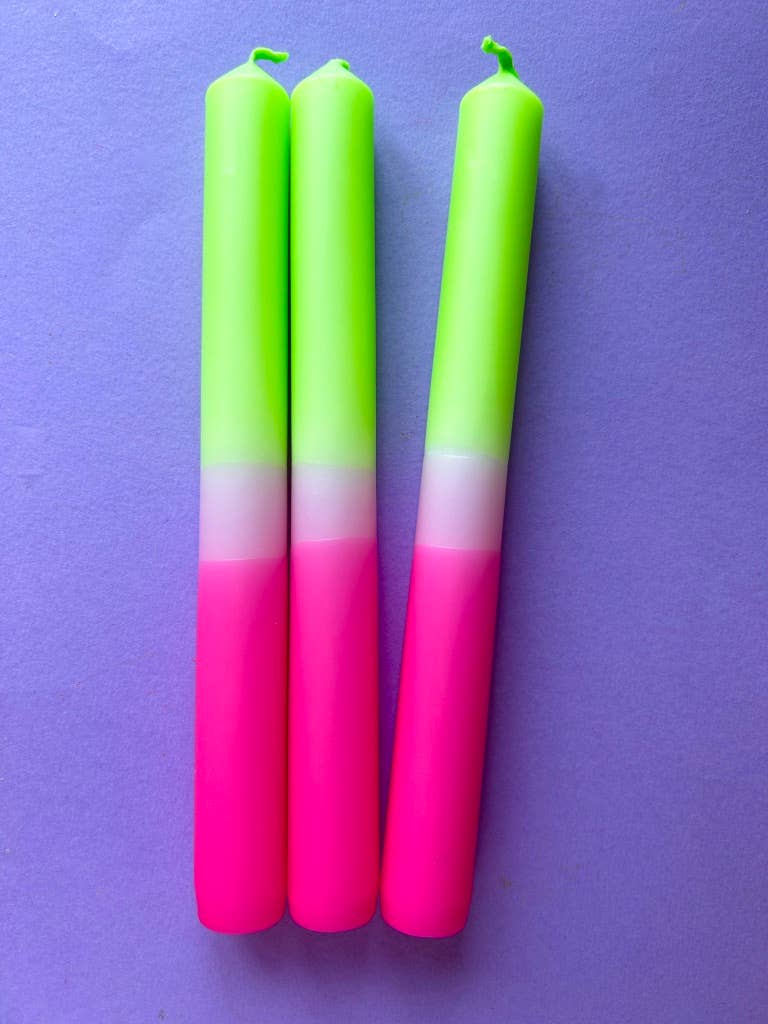 dip dyed candles. bright pink band, pale pink and topped with a lime green.