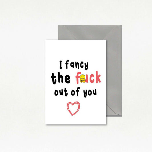 Card with text 'I fancy the fuck out of you' and a heart symbol on a white background with a gray envelope.