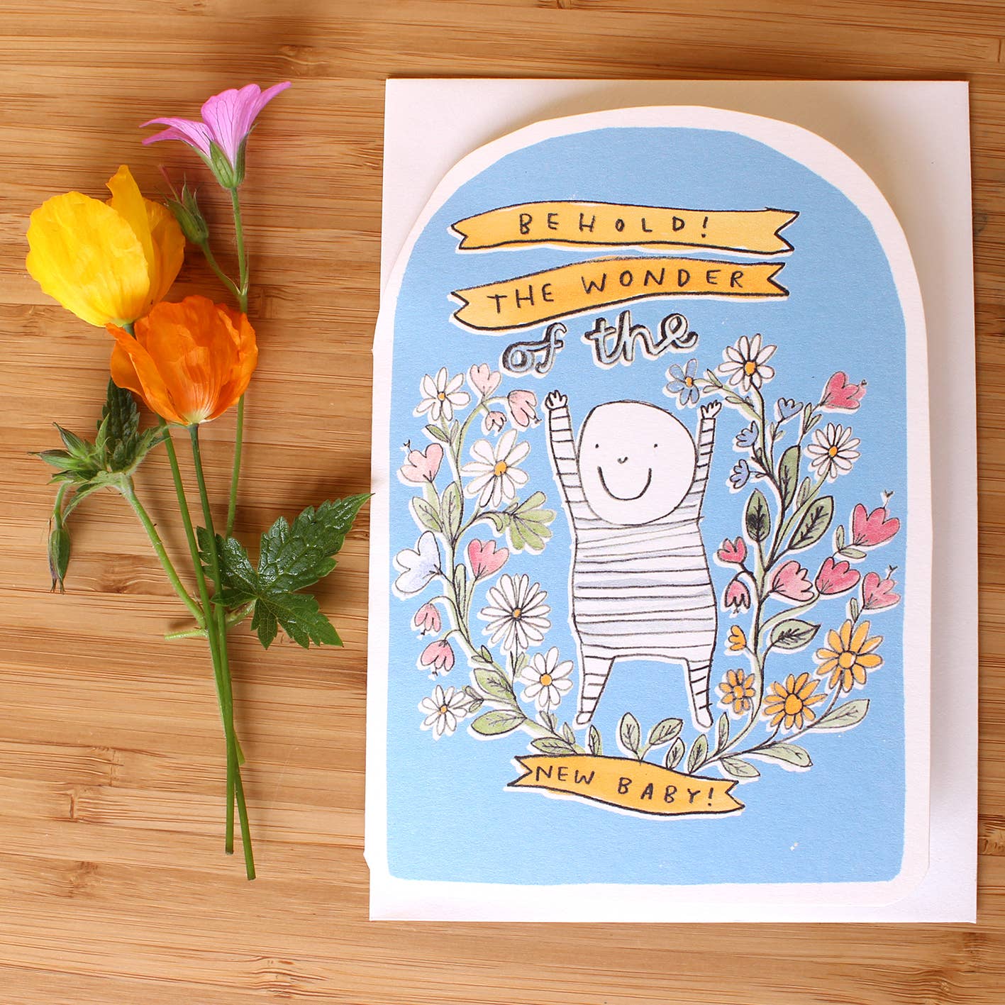 New Baby Card, pretty illustration of a baby amongst flowers wording reads Behold! The wonder of the new baby!