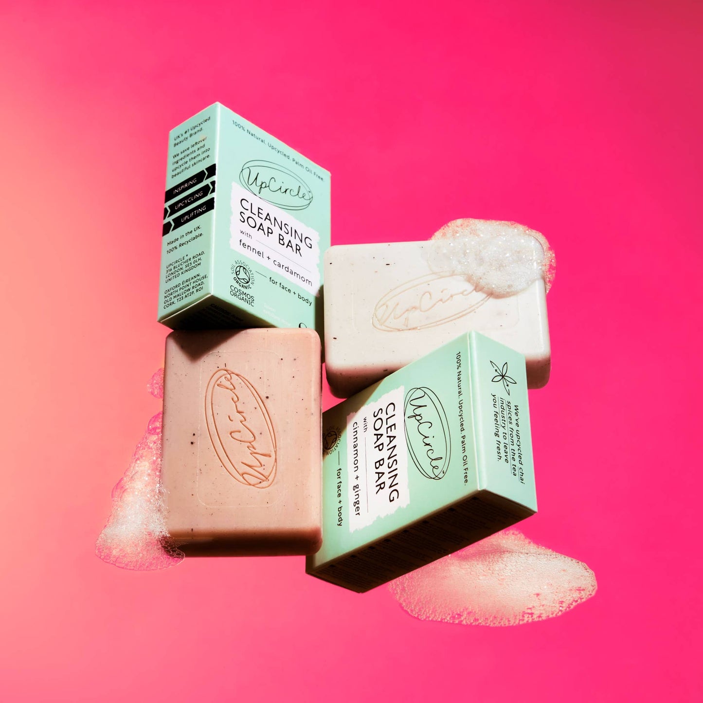 UpCircle cleansing soap bars with packaging on a pink background